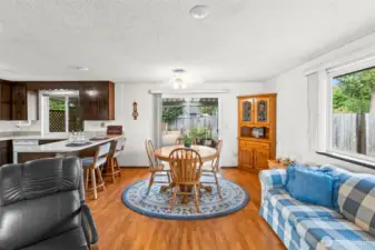 Through the slider, you access the rear covered deck and big back yard.