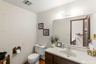 Convenient half bath off the kitchen/laundry room
