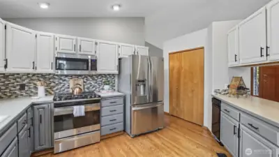 Plenty of storage with pantry access and abundant cabinet space.