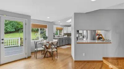 French doors open to the deck for effortless indoor-outdoor dining.
