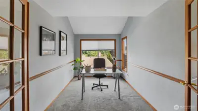 Versatile office space with French doors and a quiet setting.