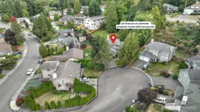 Aerial view showcasing the home and its unique offering of an additional parcel for extra space and possibilities.