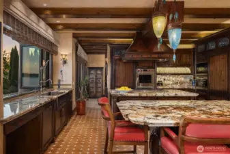 A chef's kitchen has two Islands.