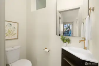 Modern bathroom featuring a clean white aesthetic and high-quality plumbing fixtures.