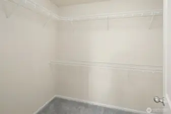 Primary bedroom walk-in closet