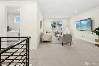 The expansive upper-level bonus room offers versatile living space ideal for a media room, play area, or secondary lounge. Abundant natural light and an open layout create a comfortable retreat that easily adapts to a variety of lifestyle needs.