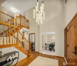 Entry Looking Towards Dining Room, Upstairs & Powder Room