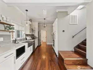 Stairs go up to 2 beds and 1 full bath