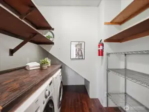 The laundry room with an abundance of storage space.
