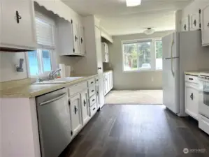fully equipped kitchen with new laminate flooring