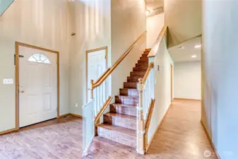 Stairs to Upper Level off Entry and Living Areas