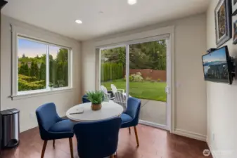 Breakfast nook with sliding glass door to patio and yard.