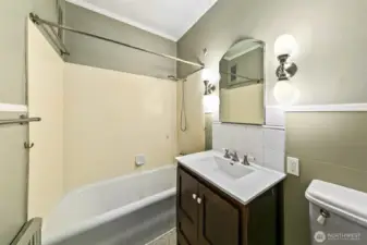 Fully functioning bath is just waiting for a remodel.  The Pantry storage is on the other side of the bathtub a perfect spot for a washer/dryer.