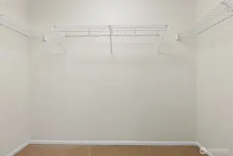 Walk in closet of primary bathroom.