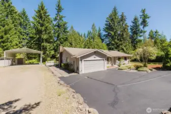 Welcome to this 1698 sq. ft. main floor living, situated on a shy acre with covered RV parking!