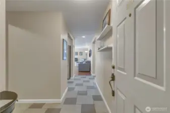As you enter your new home, you'll be greeted by tile flooring throughout the entry, kitchen, utility room, hallway, and bathroom.