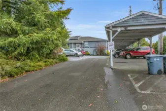 There is one assigned covered parking plus more than enough uncovered parking. It's almost like having two spots for each unit! Any overflow can park along the private road as you enter the gate.