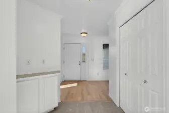Another cabinet area and entry closet.
