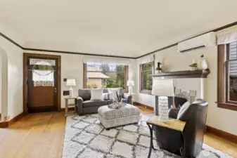 Savor period details including oak floors, coved ceilings, leaded glass windows, trim, doors, and custom fireplace.