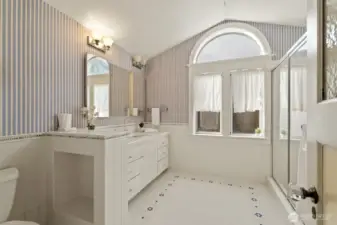 This delightful primary bath is full of vintage charm!