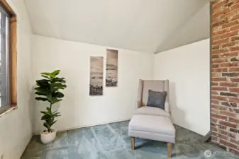 This flexible den/office area at the top of the stairs would be a perfect reading nook or work-from-home space.