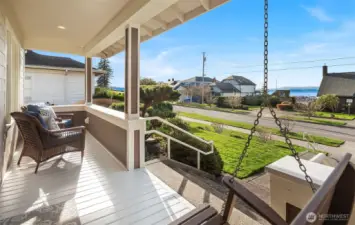 Covered front porch with swing and Sound views.