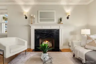 Spacious living room with fireplace. Fire added for visual (buyer to verify functionality).