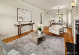 Living room flowing seamlessly to dining room.