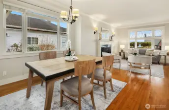 Dining room framed with large windows.