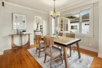 Dining room flowing seamlessly into kitchen and additional sitting area.