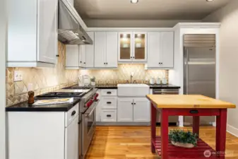 Spacious kitchen with stainless appliances & solid quartz counters.