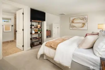 Primary bedroom with built in storage and ensuite bath.