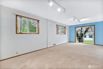 Large and bright bedroom with access to the private back yard.