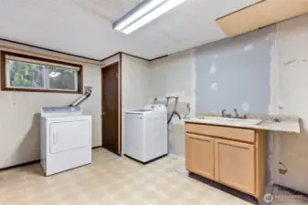 Large Laundry Space with tons of storage.