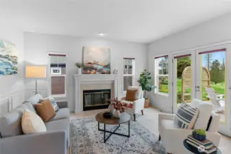 Living room with wainscotting, fireplace and deck access.