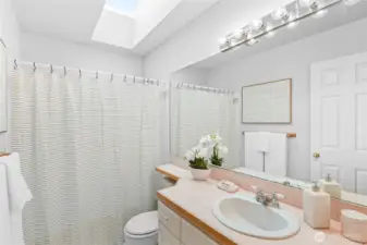 Skylit hallway full bath.