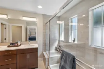 The Primary En-Suite has an extra-long shower w/ a seat and dual vanities.