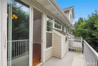 The upstairs balcony is just off of the main living and dining area.