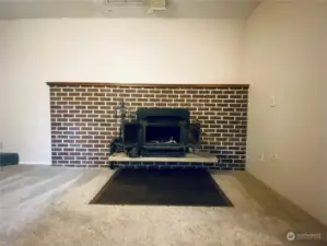 Wood burning fireplace in family room to keep you toasty in the winter months.