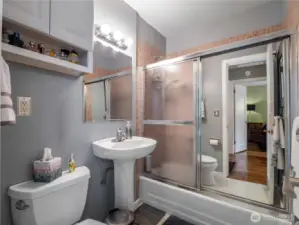 Next to the bedrooms, you will find the bathroom, which is off the living room.
