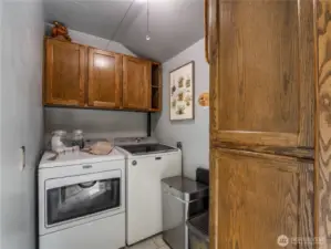 Off the kitchen, you'll find the laundry room, which also has extra storage space for a pantry.