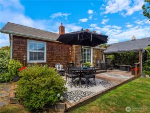 This back deck is the perfect getaway with its space for covered and uncovered seating.