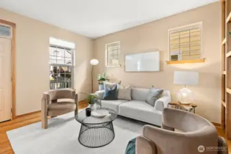 Open main level with living room sitting area pictured here.