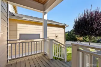 Covered porch access from garage side of house.