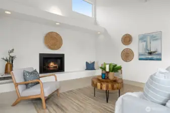 The gas fireplace warms the living room up on a chilly day or evening, and there is a large hearth for additional seating.