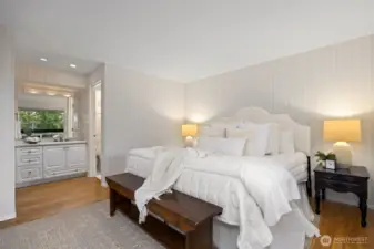 There is a large vanity with a separate shower and toilet room off the primary bedroom.