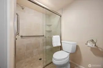 The other 3/4 bath on the lower level was also updated with travertine tiles and is very lovely.