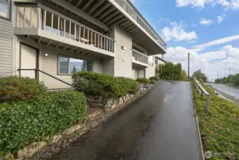 The studio apartment is below the deck that is off the primary bedroom just off the driveway.