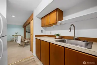 The kitchen is efficient and only lacks a dishwasher. It has solid oak cabinets.