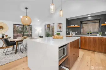 Gorgeous kitchen with custom cabinets, quartz, designer tile and SS appliances
